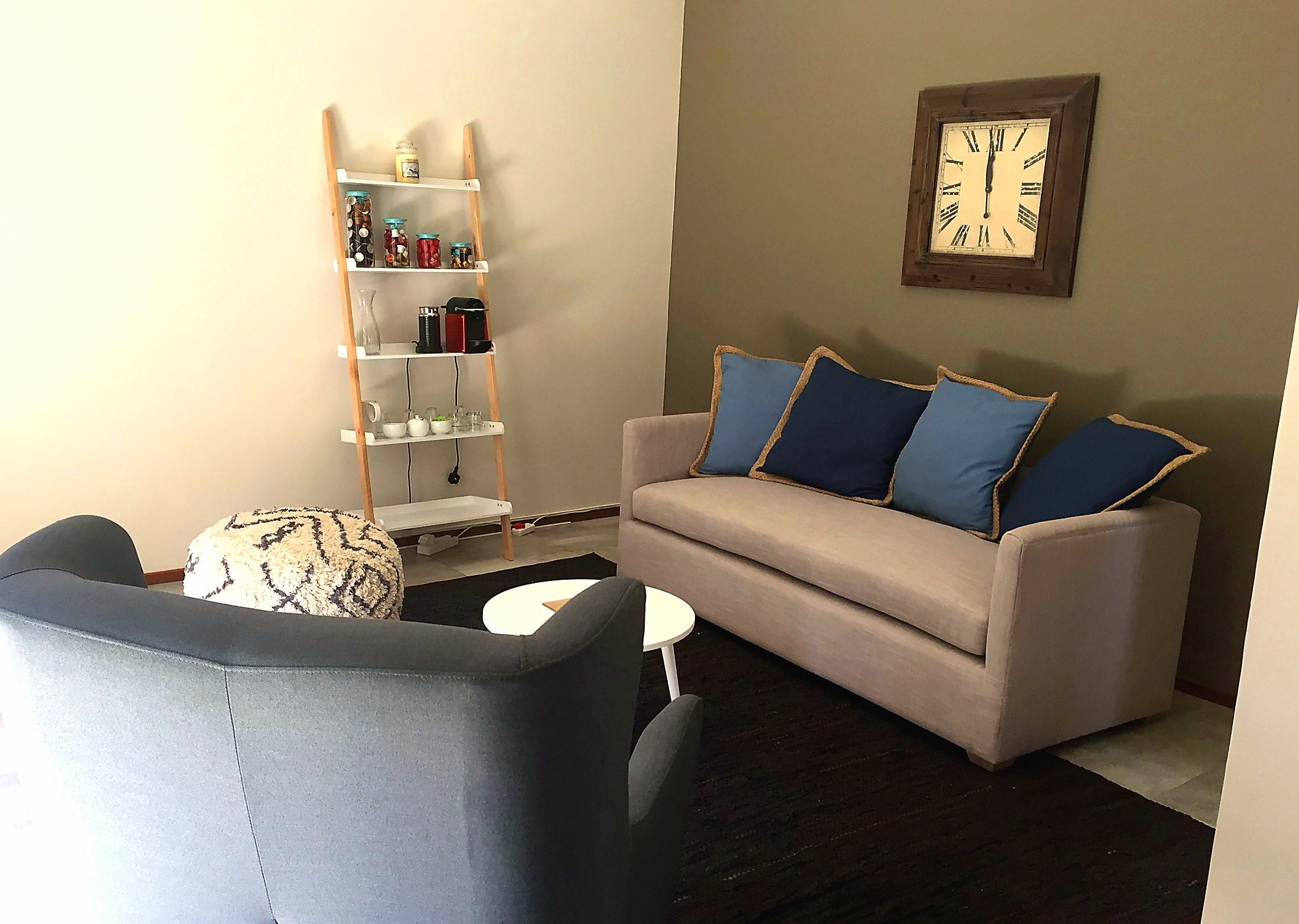 Calm consulting room with seating and soft natural light